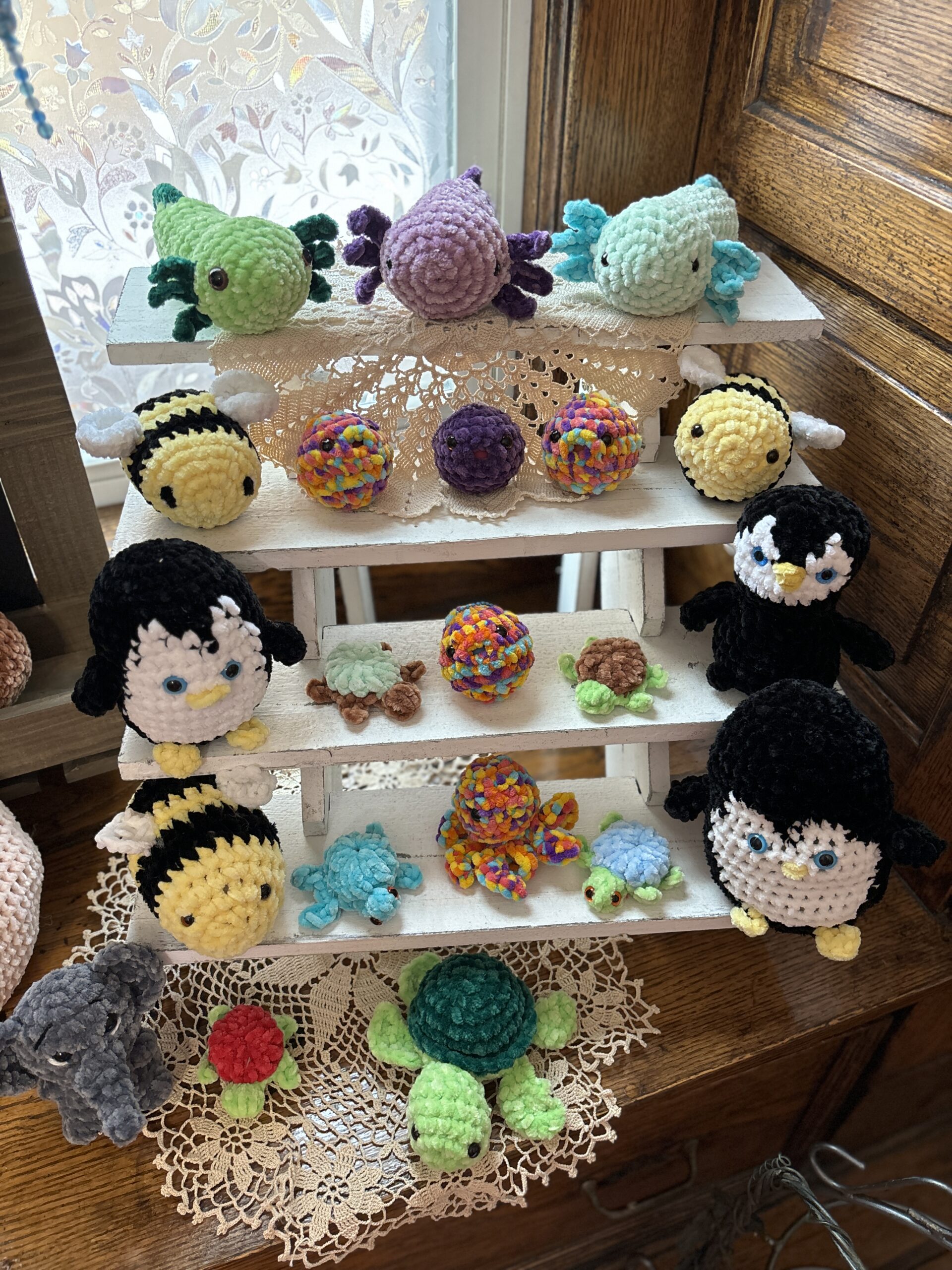 A shelf of crochet animals
