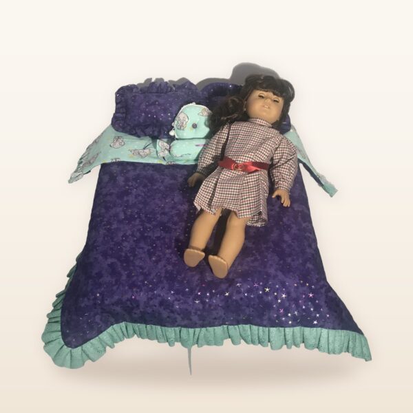 Purple doll bed with ruffle and doll